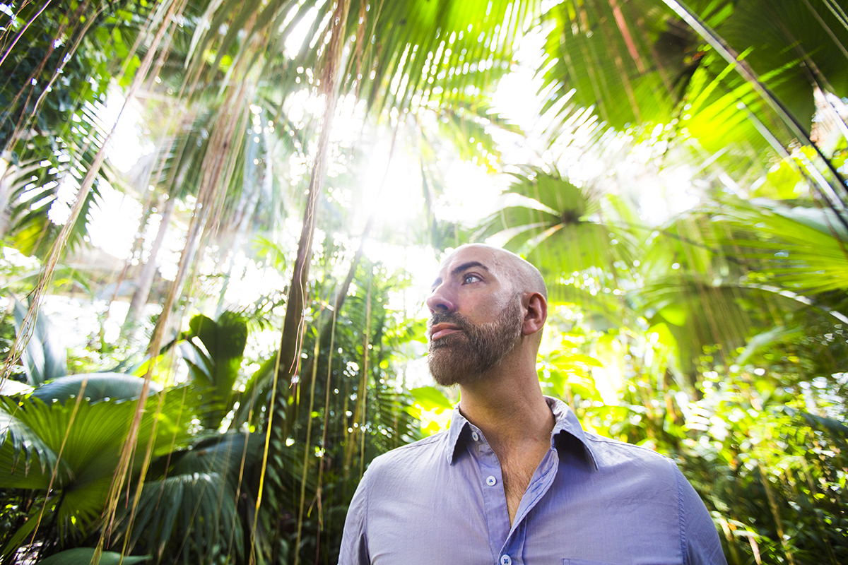 Portrait of Emory researcher Thomas Gillespie in a jungle setting