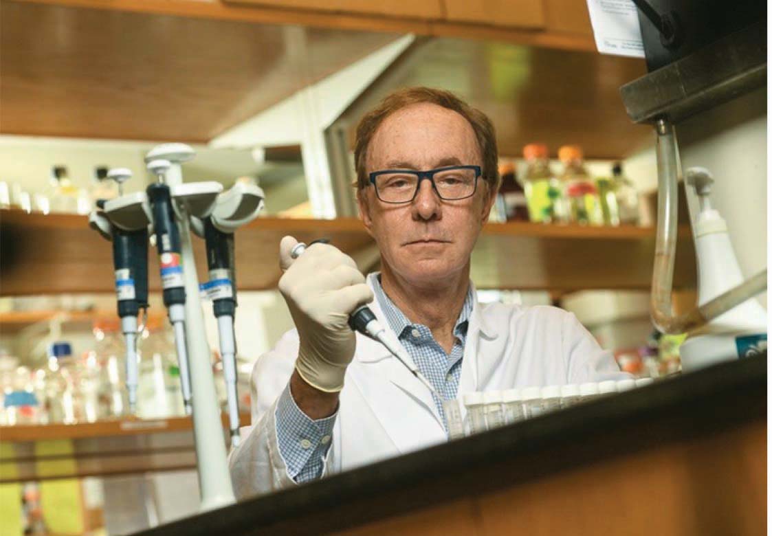 a shot of George Painter at work in the lab