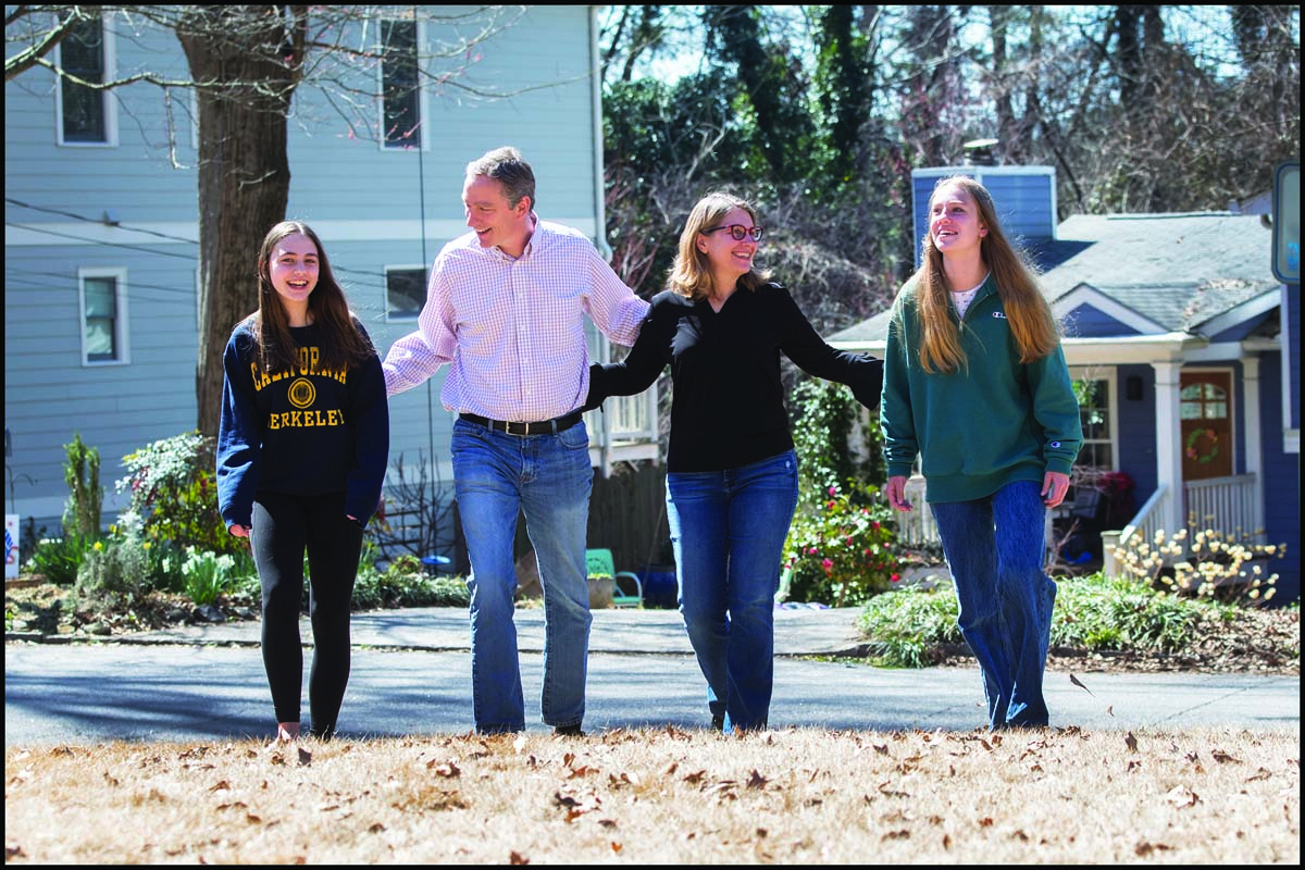 Jennifer Fagan walks arm in arm with her husband and two children.