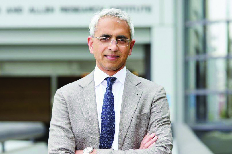 Photo of Ravi Thadhani in front of a blurred building.