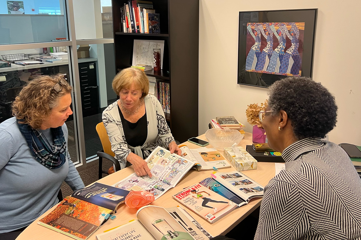 Photo of Camille Vaughan with the editors of Health Digest working