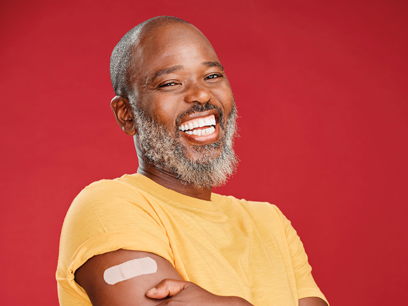 man with bandaid on arm